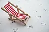 A view of a red beach chair on a calendar to show days off