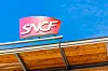 A view of the SNCF logo on a sign on a building