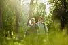 A view of an older couple hiking in the countryside