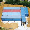 An aerial view of shipping containers which have been placed as the foundations of a future home