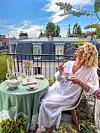 Karen Bussen relaxing on a balcony