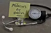 A view of a doctor stethoscope and a post-it note saying ‘Médecins en grève’ (Doctors on strike)