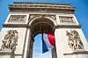 French,Flag,Waving,Under,Arc,De,Triomphe,In,Honor,Of