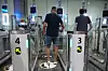 Air travellers pass through automated border control gates