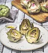 Artichoke with vinaigrette, wood background