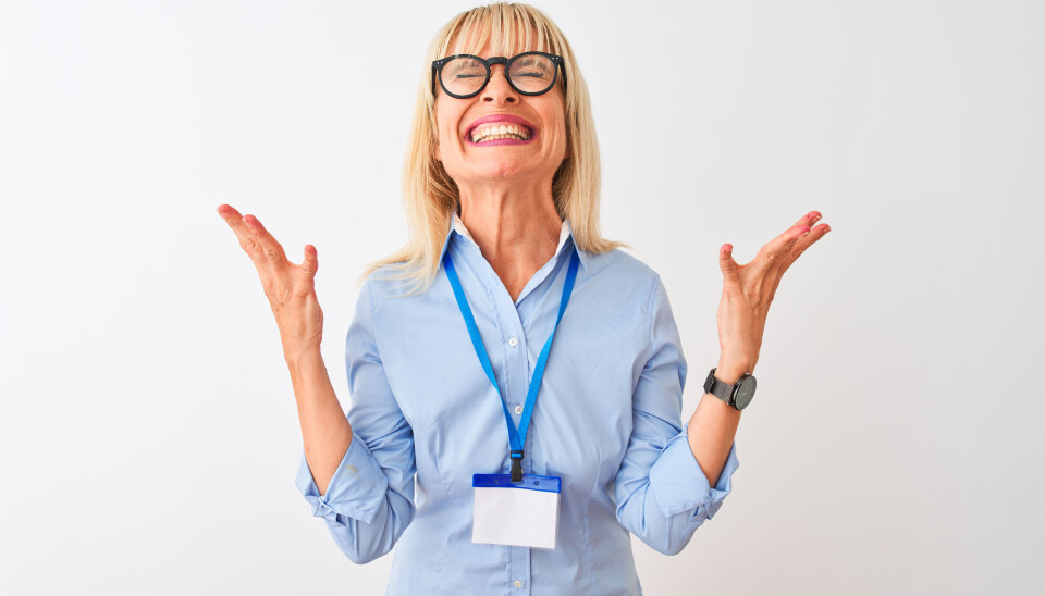 Woman wearing name badge expressing her frustration.