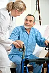 Doctor,Or,Nurse,Helps,A,Senior,Patient,To,Get,Up