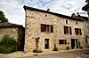 Traditional,French,Stone,House,With,Wooden,Shutters,On,A,Quiet