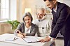 Senior,Couple,Signing,Paper,,Young,Professional,Consultant,Helping,Advising,On