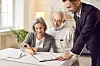 Senior,Couple,Signing,Paper,,Young,Professional,Consultant,Helping,Advising,On