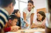 Female,Teacher,And,Pupils,Playing,Board,Game,Together,In,Classroom.