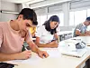 Group,Of,Diverse,Teenager,Students,Doing,An,Exam,In,A
