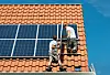 Workers,Installing,Solar,Panels,On,Roof,Framework,Of,New,Home,