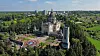 A large church surrounded by trees