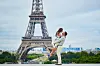 Happy,Romantic,Couple,Hugging,Near,The,Eiffel,Tower,In,Paris,