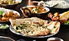 Indian,Naan,Bread,With,Herbs,And,Garlic,Seasoning,On,Plate