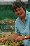 A woman in a greenhouse