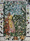 Mosaic mural of a woman in a yellow dress reaching toward birds among flowers and leaves.