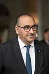Laurent Nunez in a dark suit and blue tie at an official event in Paris