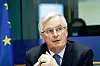 Michel Barnier speaking at a European Parliament committee meeting in Brussels, with an EU flag in the background.
