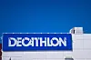 Decathlon store building with a blue sign against a clear sky.