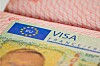Close-up of a France Schengen visa sticker in a passport.