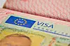 Close-up of a France Schengen visa sticker in a passport.