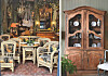 Antique chairs and table in a decorative room beside a wooden cabinet displaying plates.