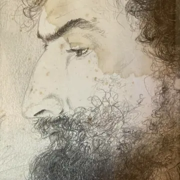 Side profile sketch of a bearded man with curly hair on textured paper.