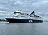 Dfds Crown Seaways ferry on calm water in Oslo under overcast skies.