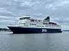 Dfds Crown Seaways ferry on calm water in Oslo under overcast skies.