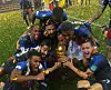 France players celebrate around the FIFA World Cup trophy on a confetti-covered pitch in Moscow.