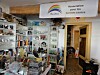 Interior of a French charity shop filled with books, ceramics and vintage ornaments