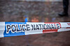 Close-up of French National Police security tape stretched across a blurred scene