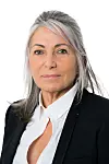 Evelyne Renaud-Garabedia in a black blazer and white shirt against a white studio background