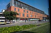 Modern hospital emergency department in Toulouse, France, with an URGENCES sign and landscaped foreground.