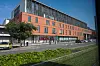 Modern hospital emergency department in Toulouse, France, with an URGENCES sign and landscaped foreground.