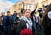 Greta Thunberg stands among demonstrators during a climate protest in a Bordeaux street.