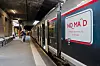 Nomad train at Rouen railway station in Normandy, France, beside a covered platform.