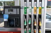 Petrol pumps and coloured fuel nozzles at a TotalEnergies station in Solaize, France
