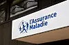 L’Assurance Maladie logo and sign displayed on a building in Paris, France.