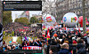 Crowd gathers around a giant branded football and flags in a city square